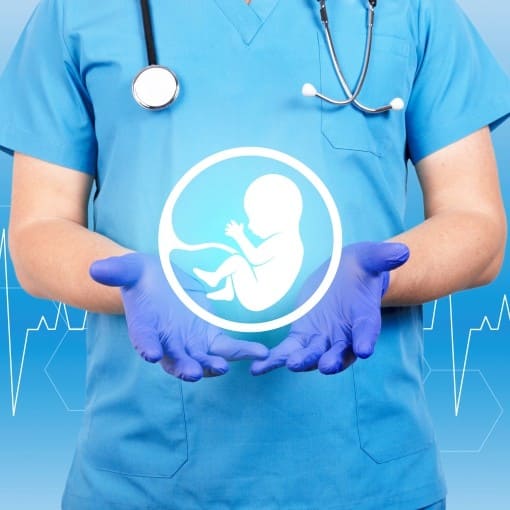 A Doctor holding a Baby